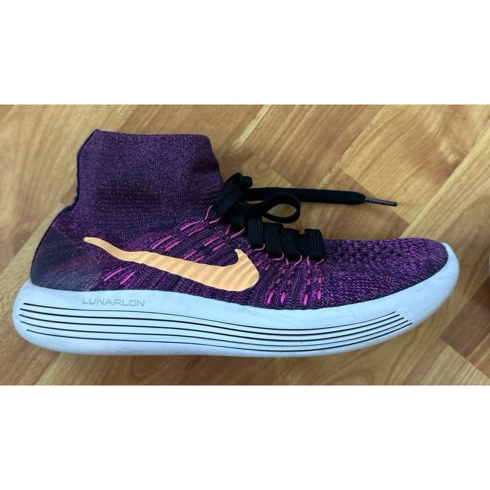 Nike LunarEpic Flyknit running shoes in a purple colorway with an orange swoosh.